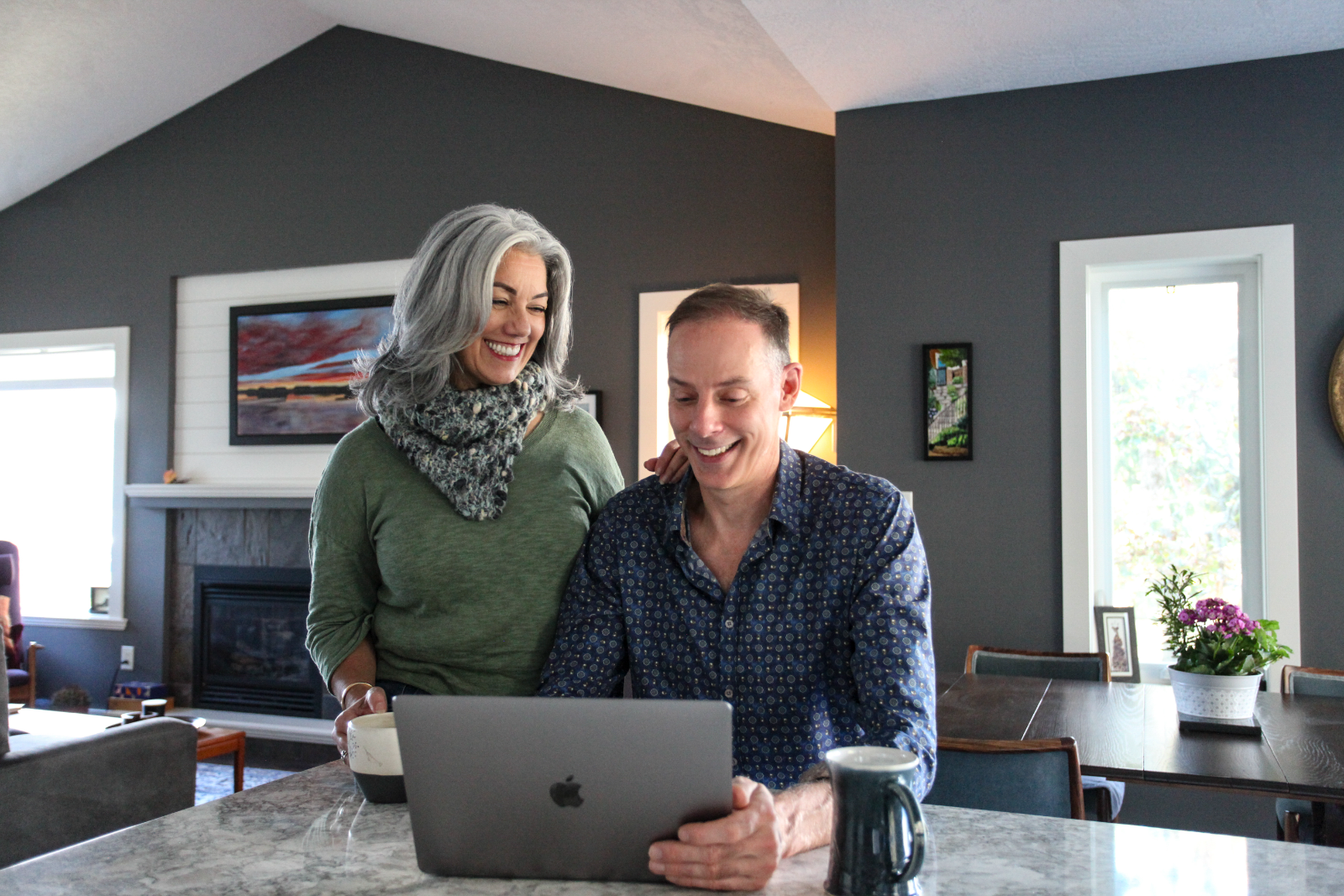 Dr. Claire Sira and Tom Hudock reviewing an intake on a laptop